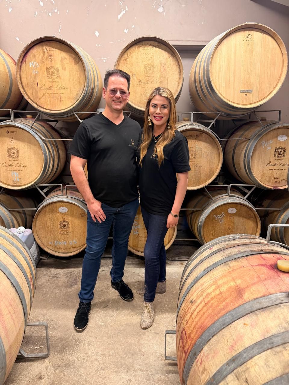 Maryke Kruger in the barrel cellar, wearing an Élu shirt